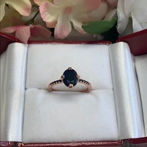 Rose gold colored size 8 ring black stone